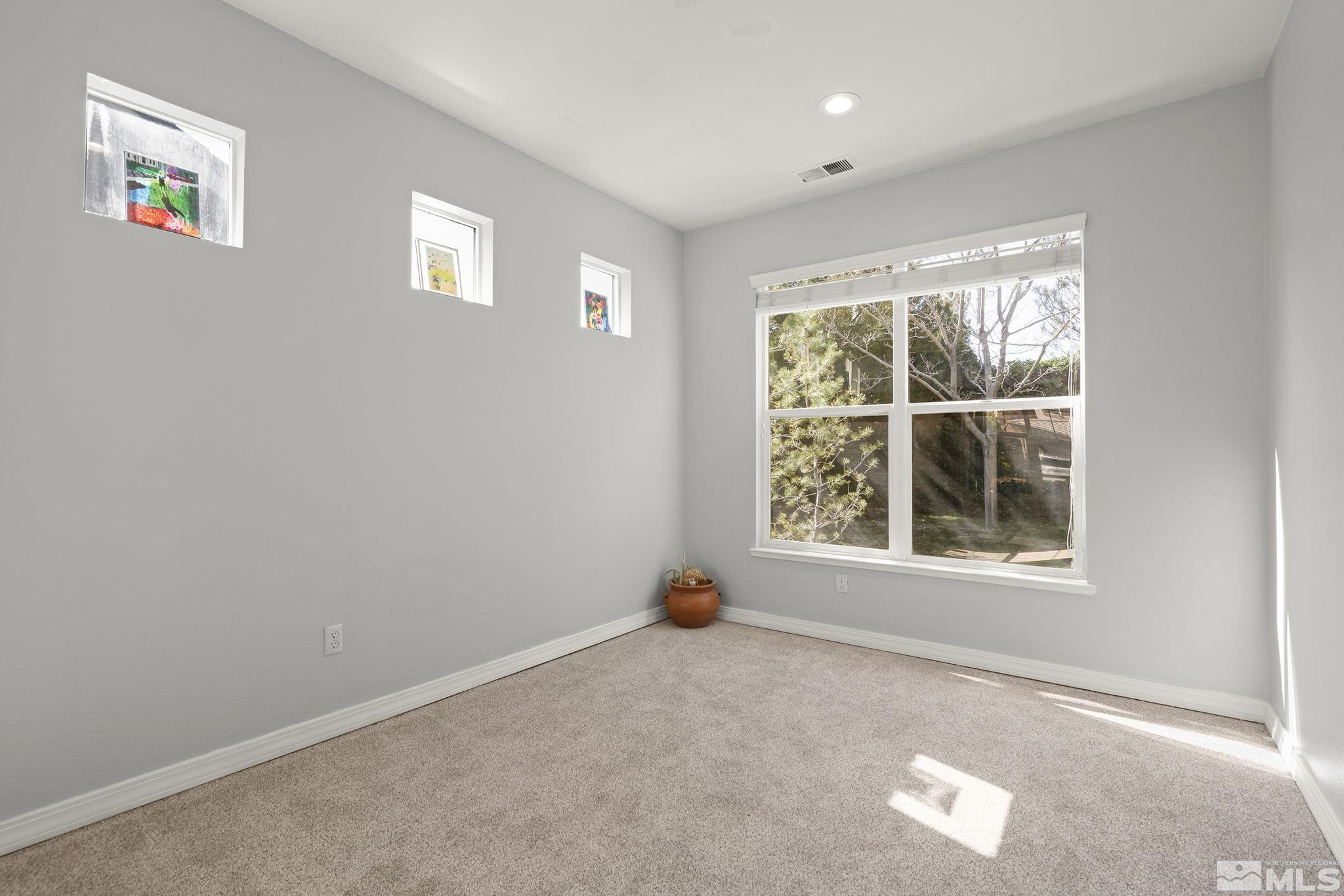 1465 Cayuse Way Reno, NV 89521 - Photo 4 of 26 an empty room with a window
