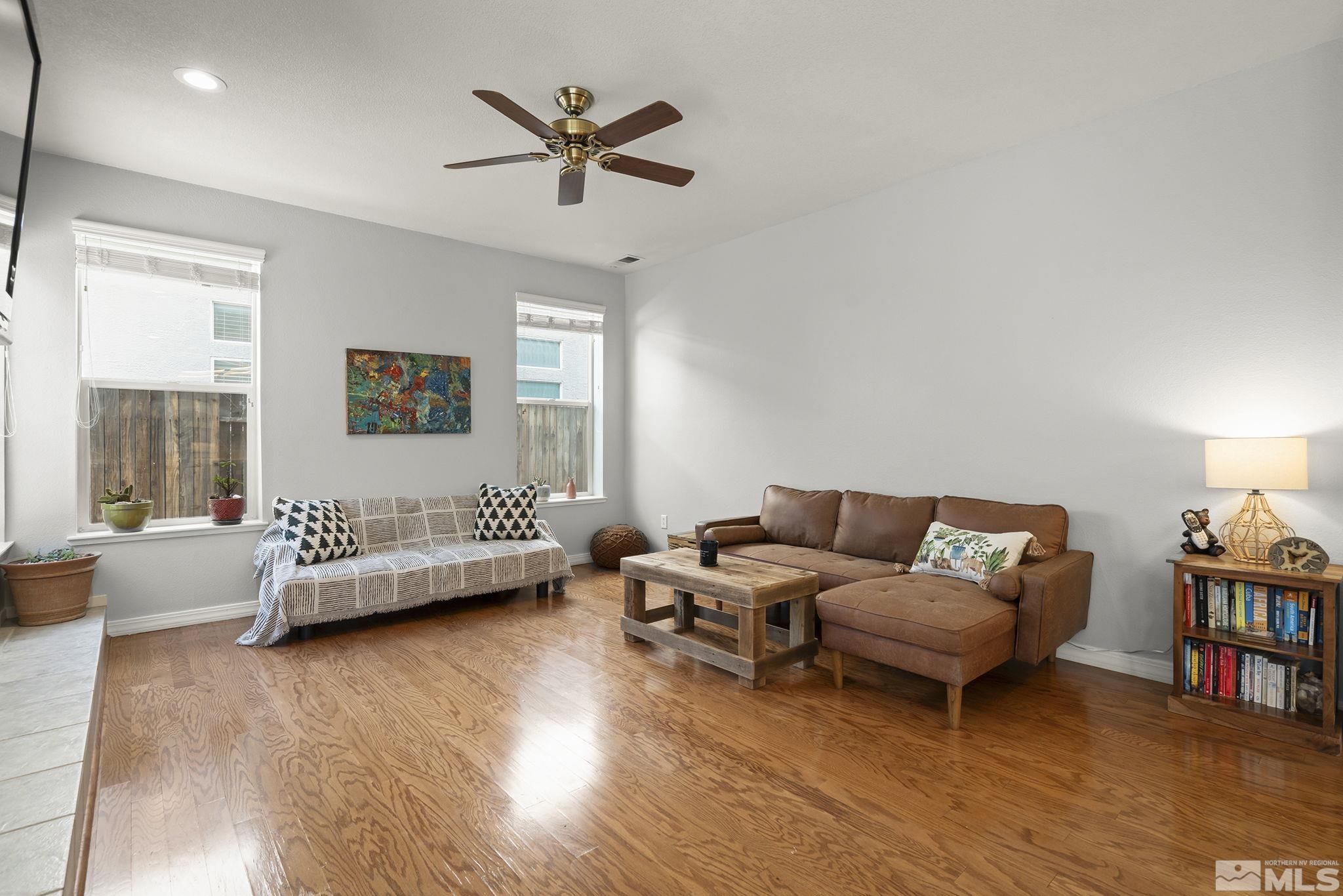 1465 Cayuse Way Reno, NV 89521 - Photo 6 of 26 a living room with furniture and a wooden floor