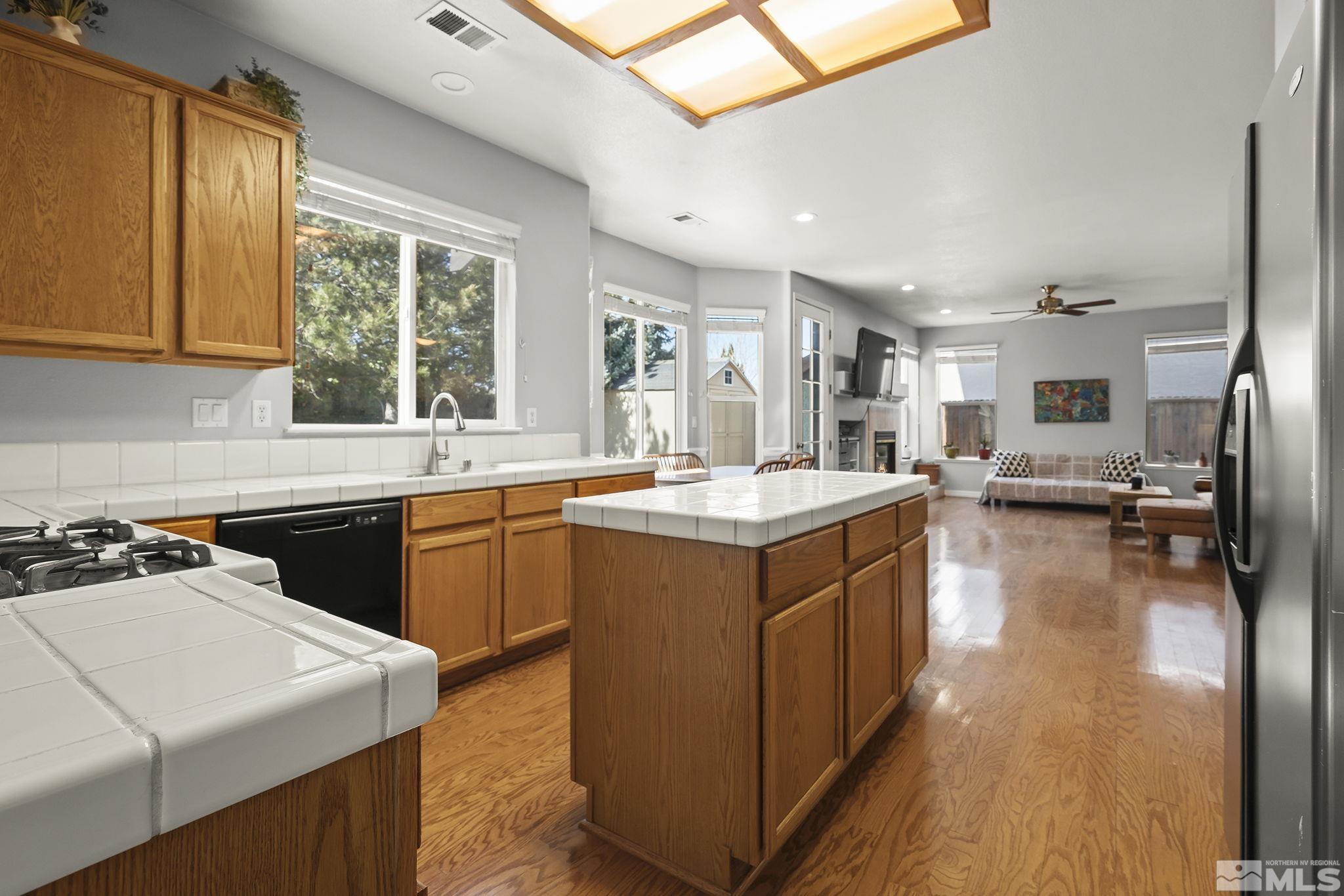 1465 Cayuse Way Reno, NV 89521 - Photo 9 of 26 a kitchen with a sink stove and cabinets