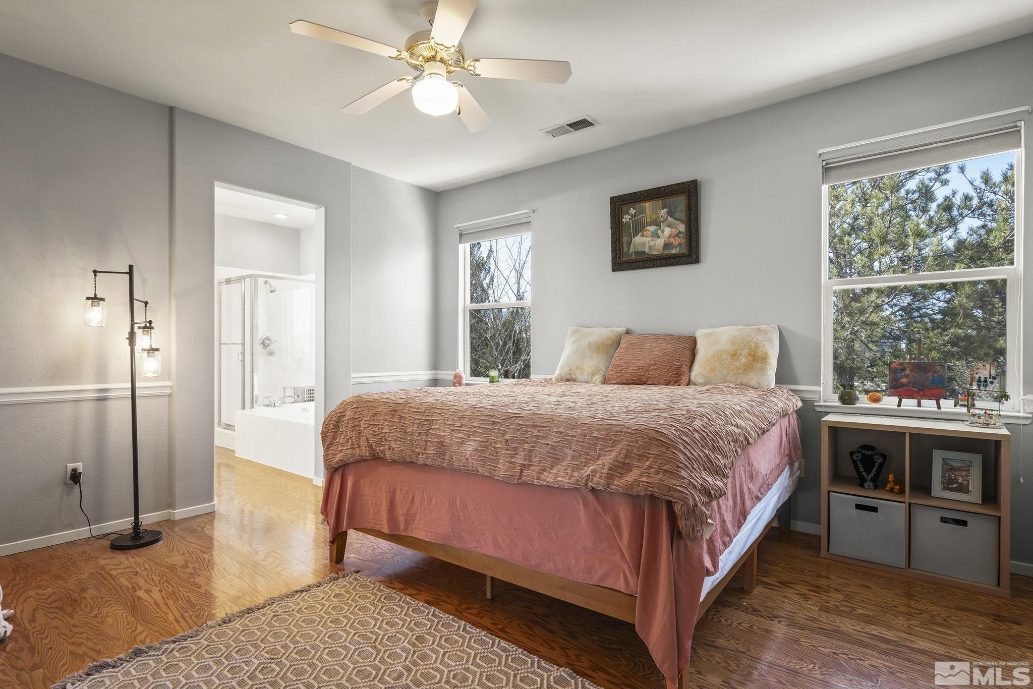 1465 Cayuse Way Reno, NV 89521 - Photo 10 of 26 a bedroom with a large bed and a window