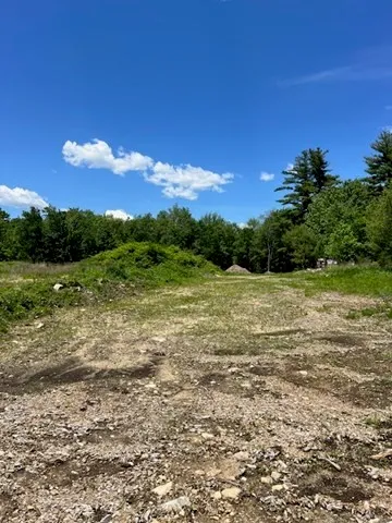 a view of outdoor space with trees all around