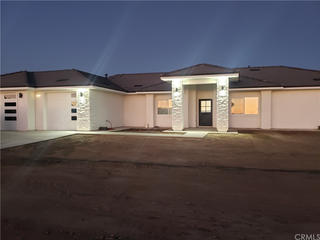 16929 Tiama Road Apple Valley, CA 92307 - Photo 1 of 1 a living room with a large window