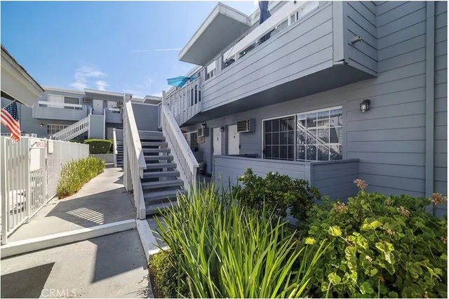 a view of a house with a flower garden