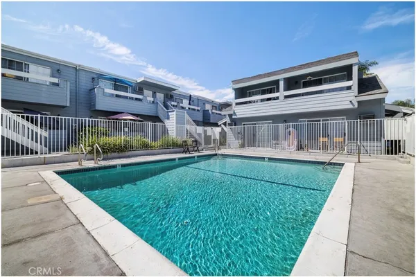 a view of house with a yard