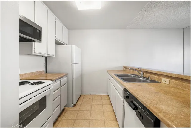 a kitchen with a stove and a sink