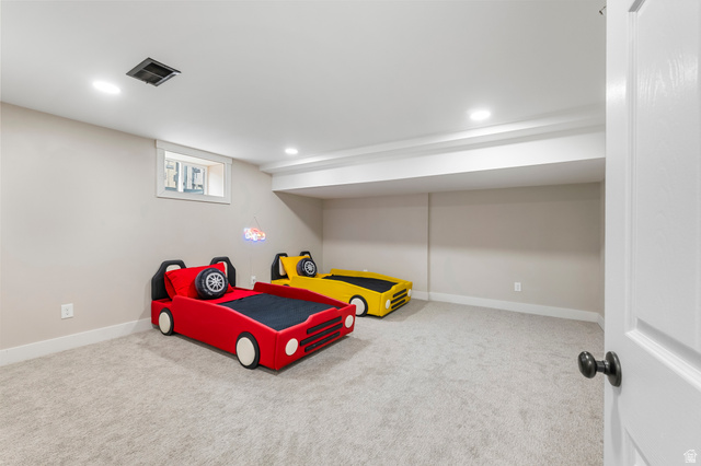 523 South Main Street Payson, UT 84651 - Photo 32 of 41 Carpeted room featuring a white interior door with a dark knob, recessed lighting, and a basement window