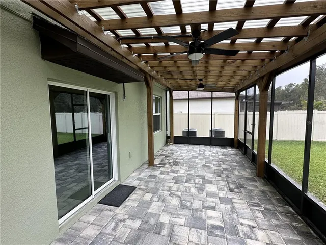 a big room with a fireplace and a table