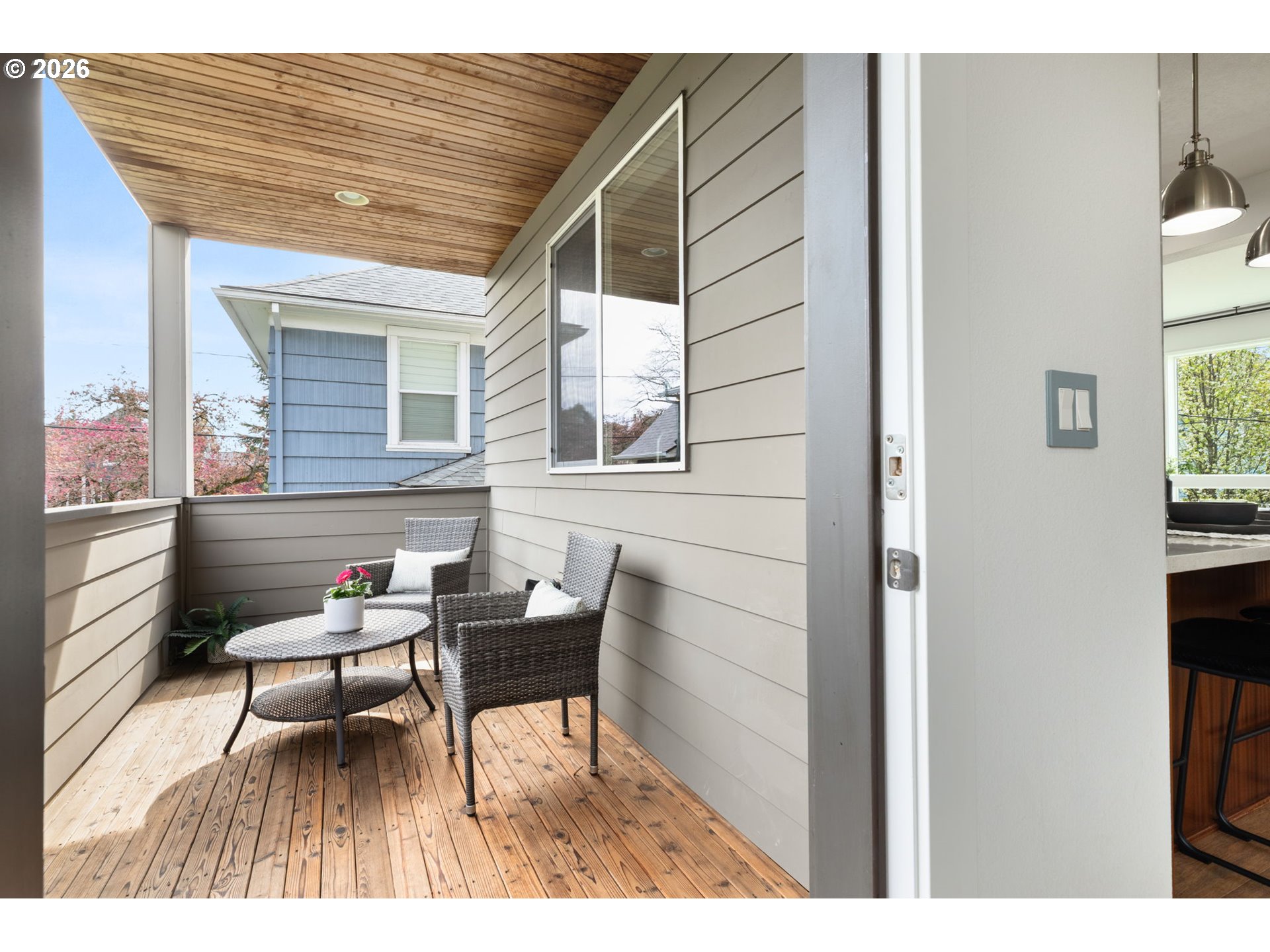 2626 Southeast 16th Avenue Portland, OR 97202 - Photo 18 of 48 a balcony with wooden benches and a couch
