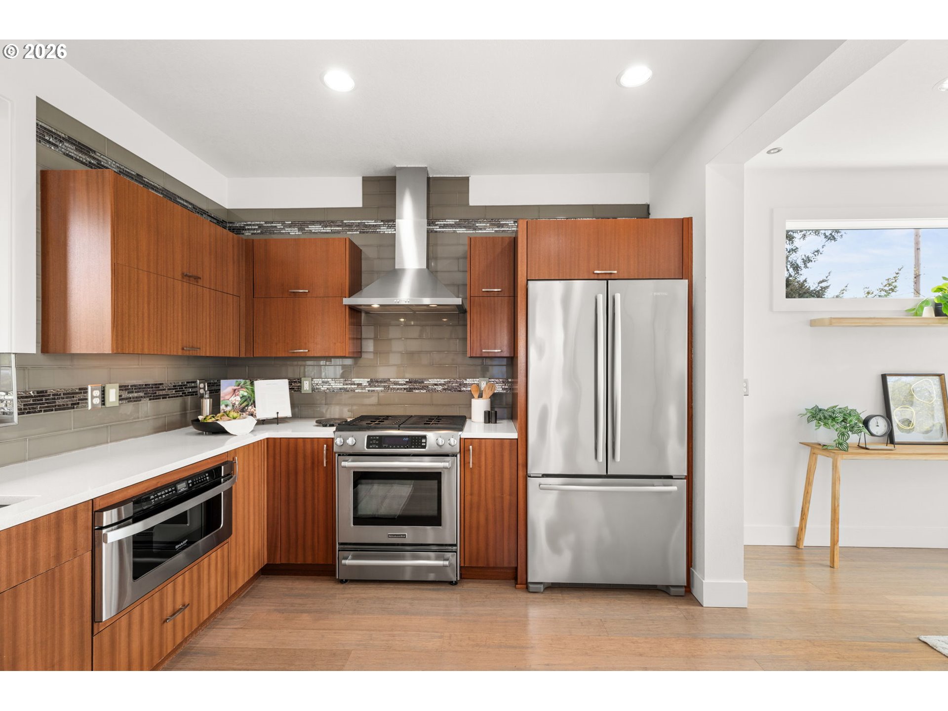 2626 Southeast 16th Avenue Portland, OR 97202 - Photo 24 of 48 a kitchen with stainless steel appliances a refrigerator and a stove top oven