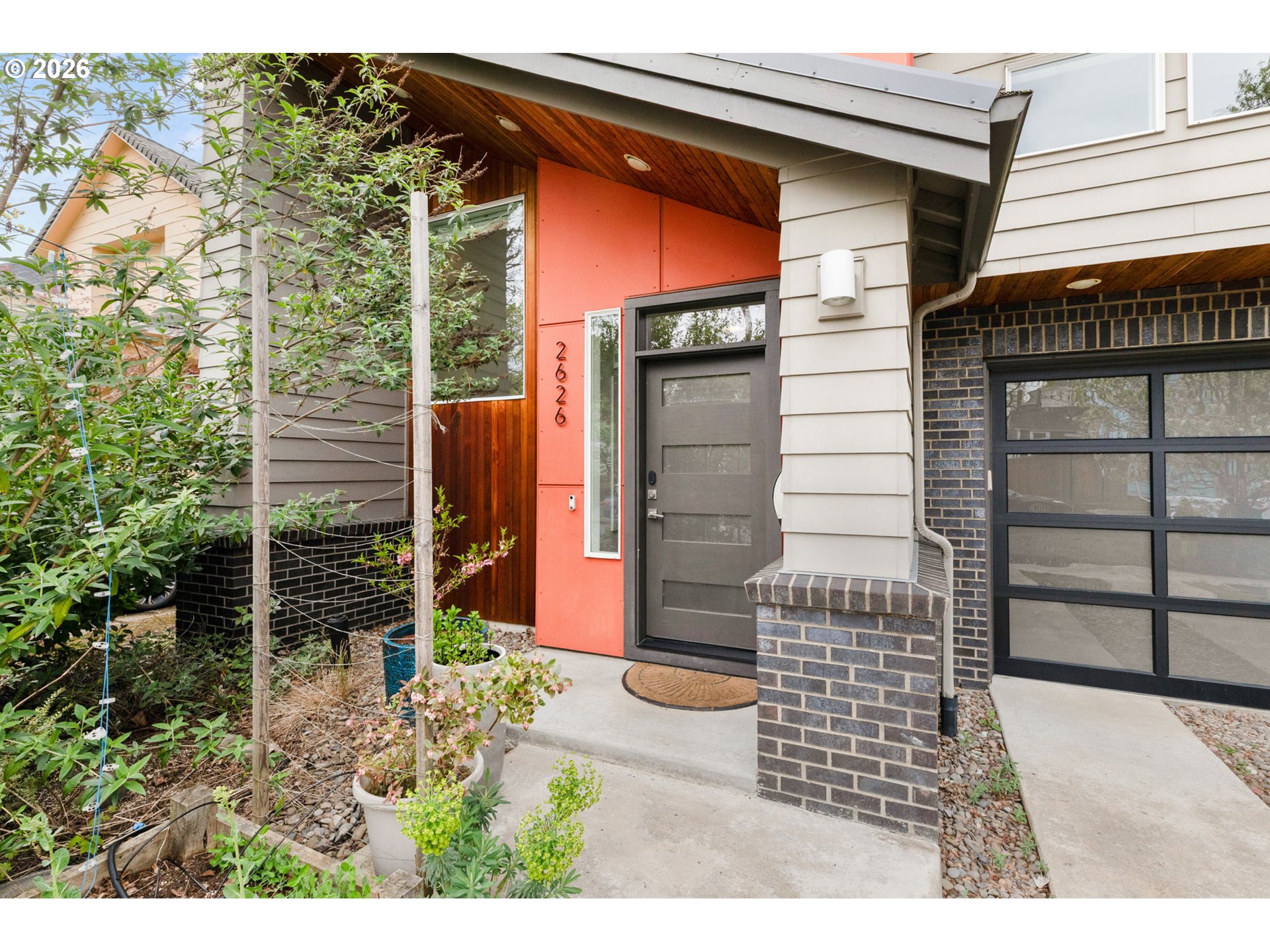 2626 Southeast 16th Avenue Portland, OR 97202 - Photo 3 of 48 a front view of a house with a garden