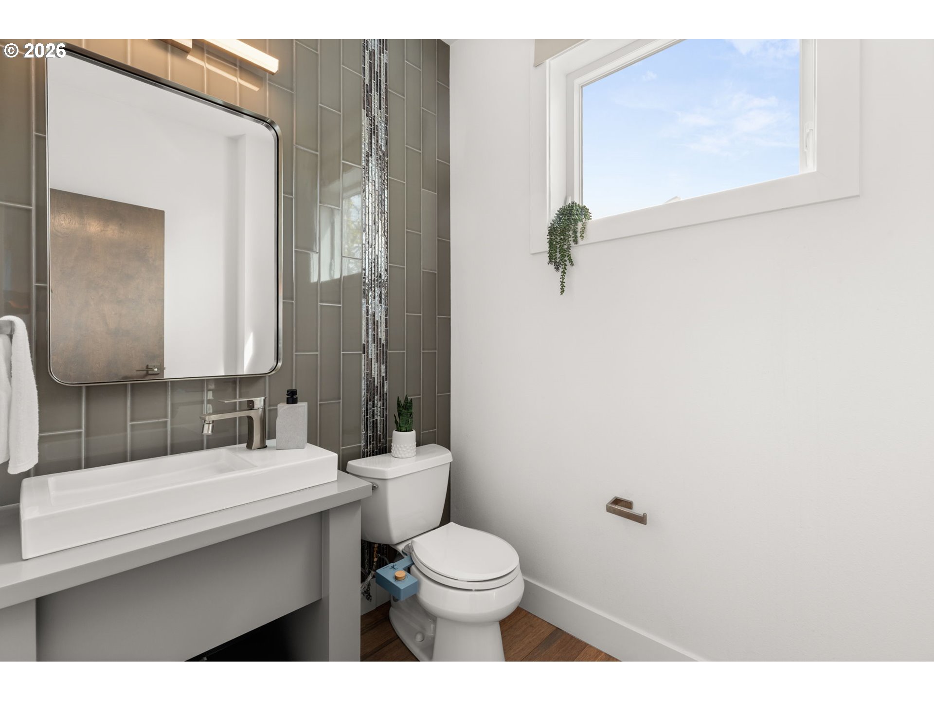 2626 Southeast 16th Avenue Portland, OR 97202 - Photo 32 of 48 a bathroom with a sink a toilet and mirror