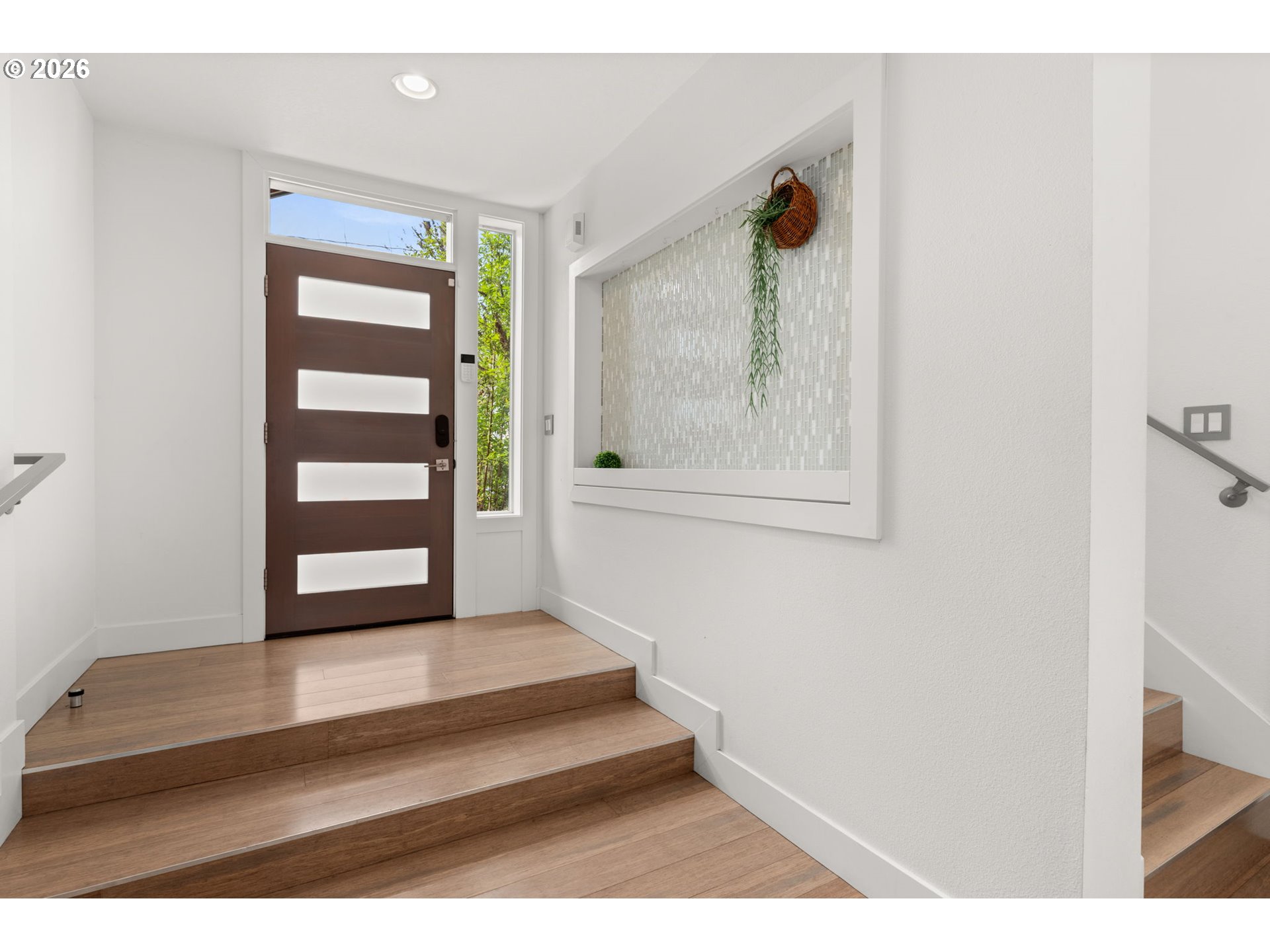 2626 Southeast 16th Avenue Portland, OR 97202 - Photo 4 of 48 a view of a hallway with wooden floor and windows
