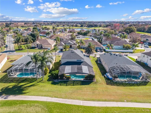 a kitchen with granite countertop white cabinets and window