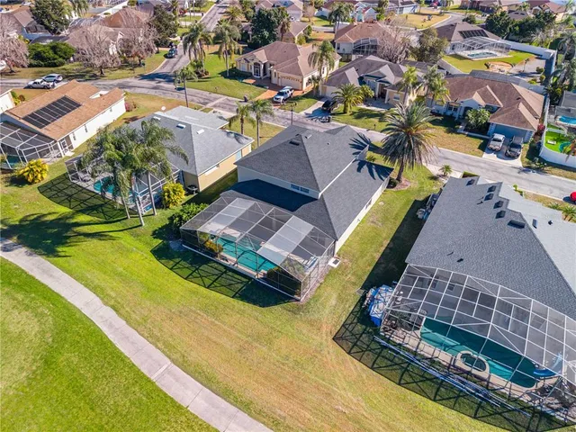 a large white kitchen with a sink and cabinets