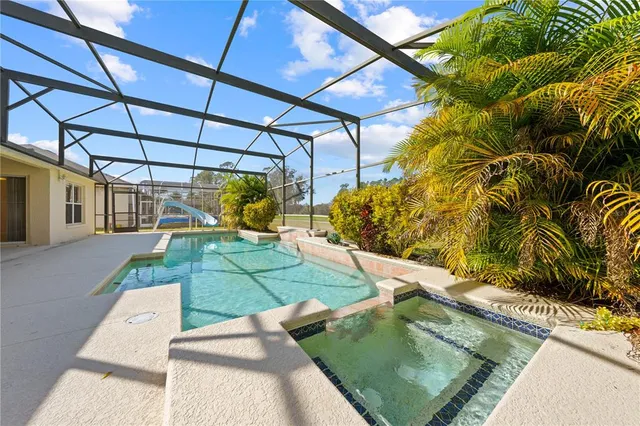 a large white bathroom with a double vanity sink a mirror and a shower