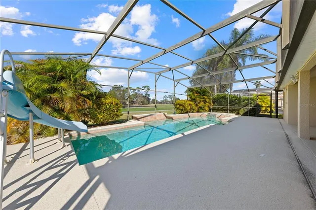 a front view of a house with yard and outdoor seating