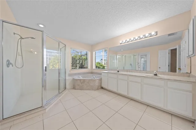 a white toilet sitting next to a bath tub