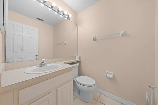 an empty room with windows and cabinet