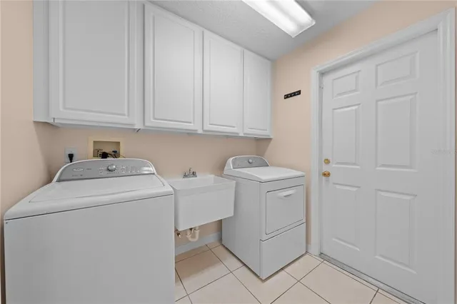 a spacious bathroom with a granite countertop sink a toilet and a mirror