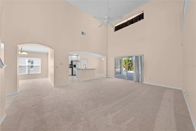 a view of a hallway with wooden floor and entryway