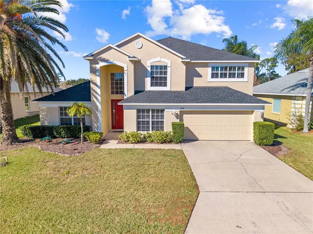 an aerial view of residential houses with outdoor space and river
