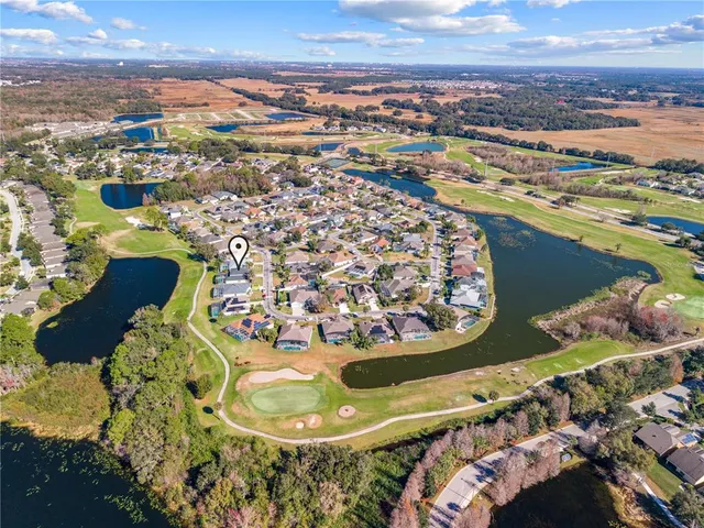 an aerial view of a house with a swimming pool yard and outdoor seating