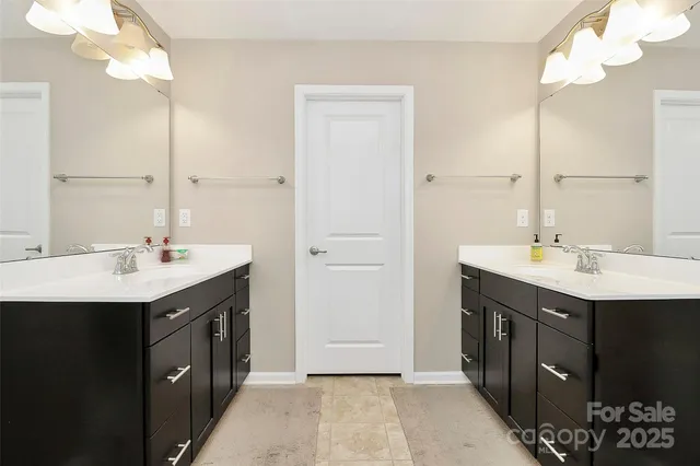 a bathroom with a sink vanity and a mirror