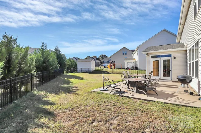 a view of a swimming pool with chairs