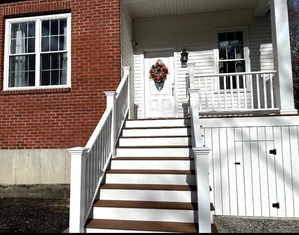 a view of entryway with a front door