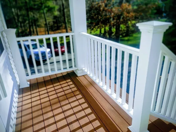 a view of a balcony with wooden floor