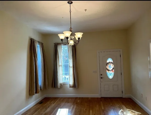 a swimming pool with trees in the background