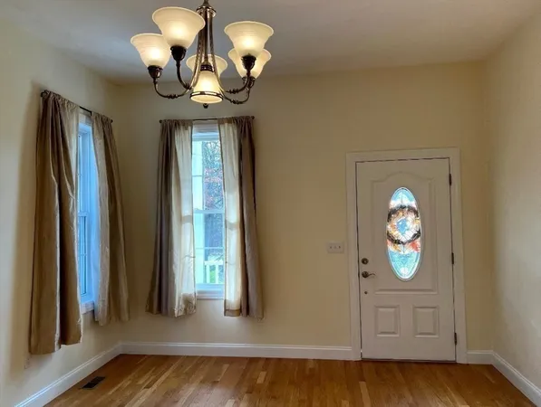 a view of entryway with wooden floor