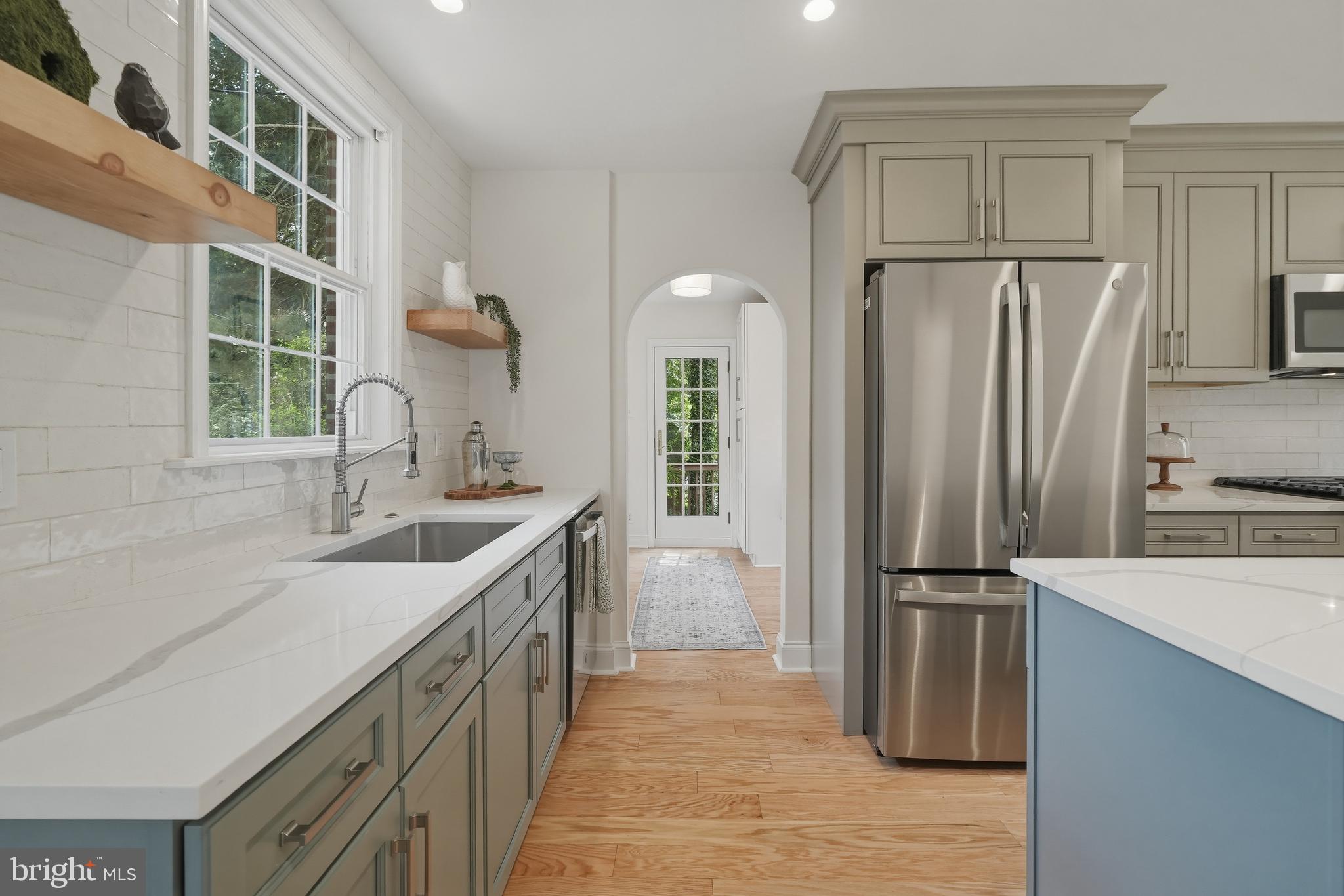 800 Pleasant Hill Road Wallingford, PA 19086 - Photo 8 of 34 a kitchen with a refrigerator and a sink