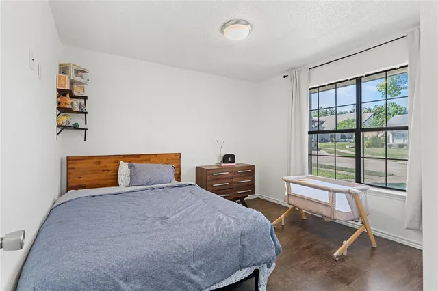 a bedroom with furniture and a window