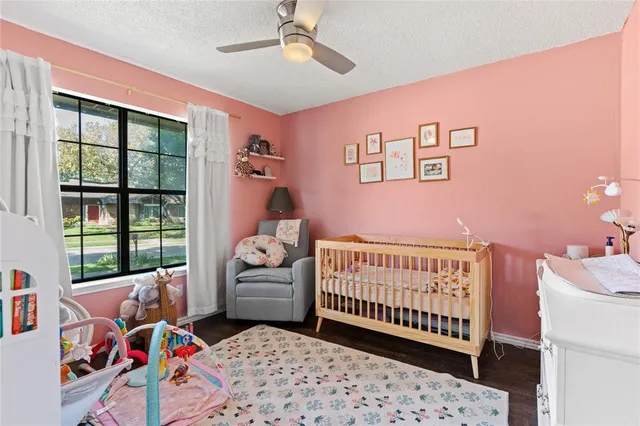 a view of a backyard with wooden fence