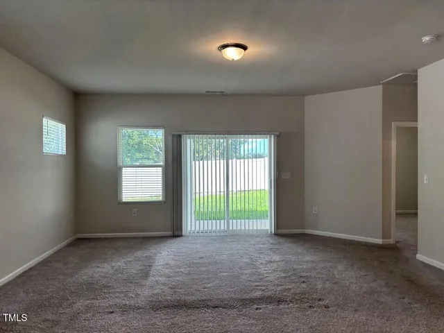 a kitchen with a sink and chandelier