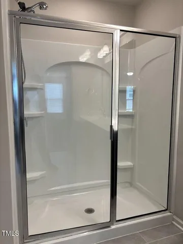 a bathroom with a toilet a sink and shower
