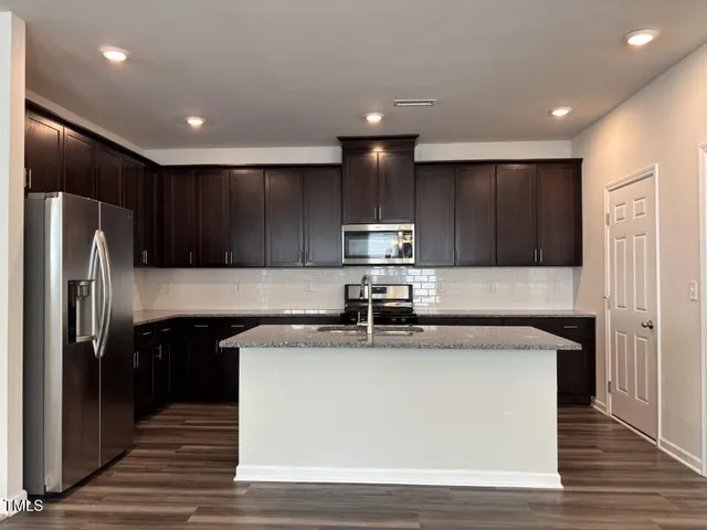 a picture of a room with a white wall and a picture of the wall