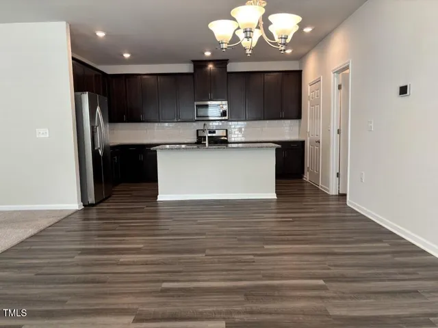 a view of a bathroom with a tub and a window