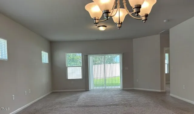 a kitchen with kitchen island granite countertop a sink a counter space appliances and cabinets