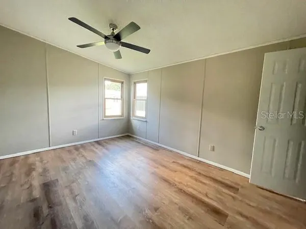 a view of an empty room and a window