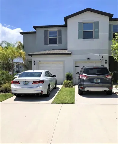 a car parked in front of a house