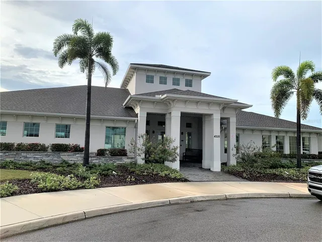 a room with gym equipment and a large window