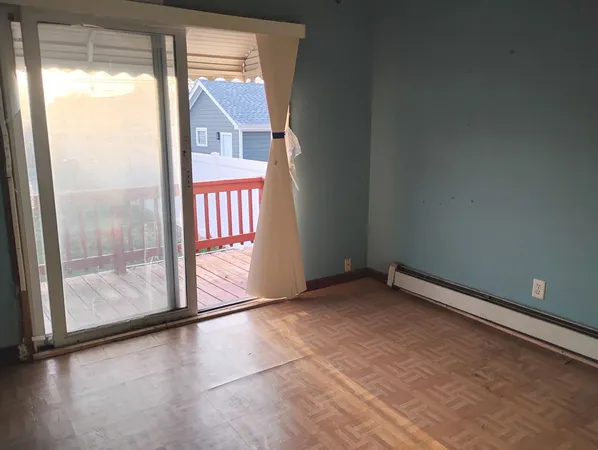 a view of an empty room and window