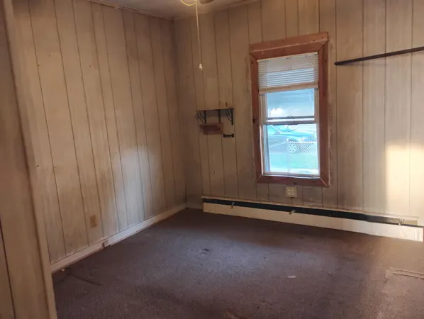 an empty room with mountain view