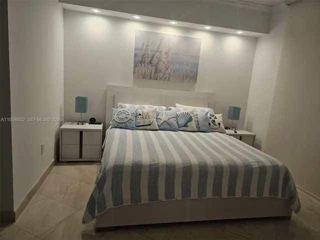 a bedroom with a bed and a walk in closet