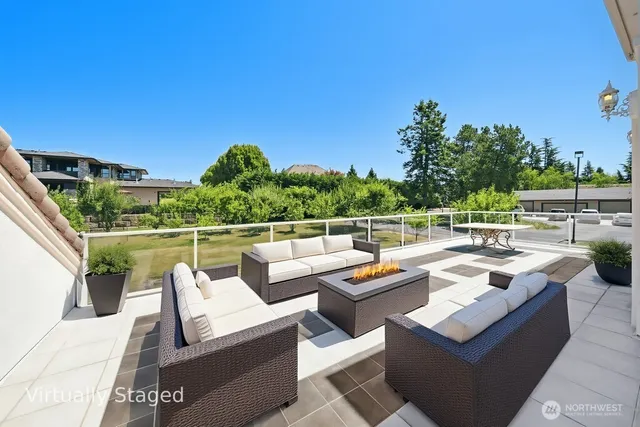 a outdoor living space with furniture and city view