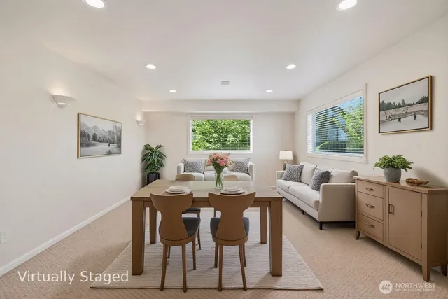 a view of a dining room with furniture and window