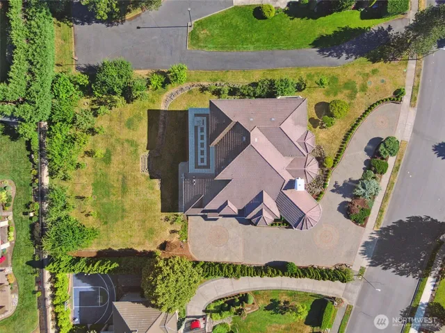 an aerial view of a house with a yard