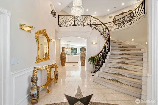 a view of entryway and hall with a front door